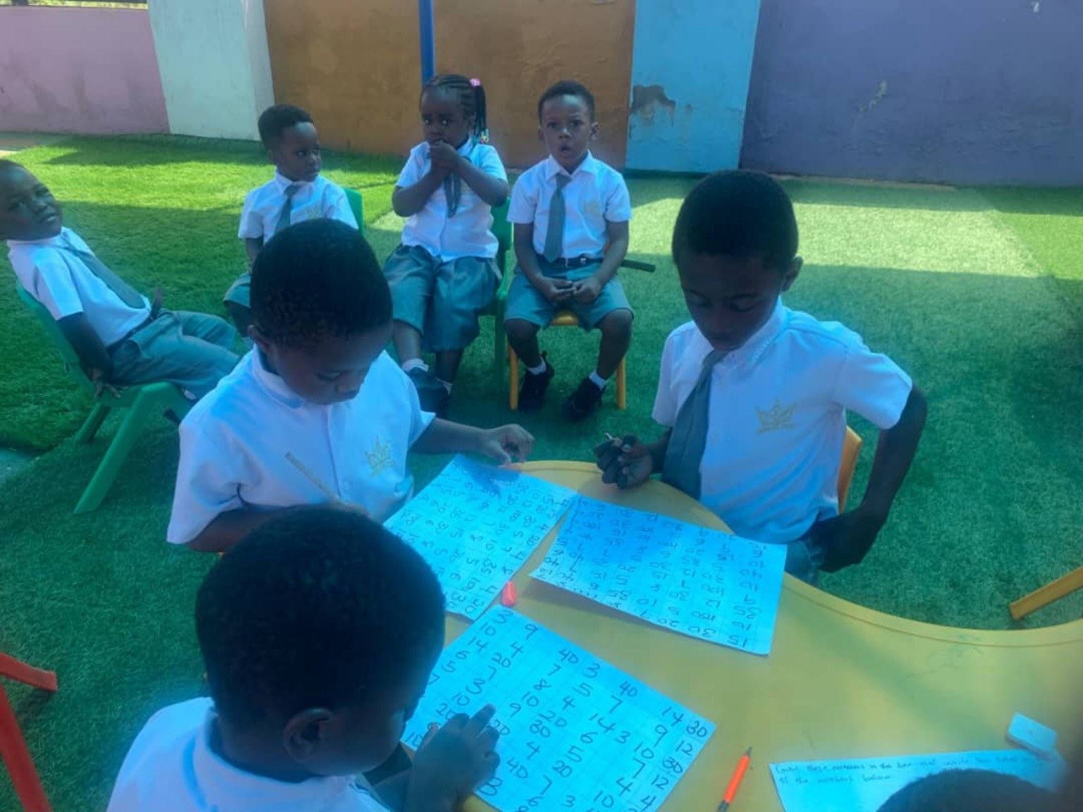 Children writing outdoors